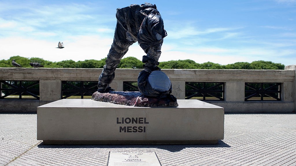 

What is left of the statue of soccer star Lionel Messi is seen covered in Buenos Aires, Argentina. (Photo: AP)