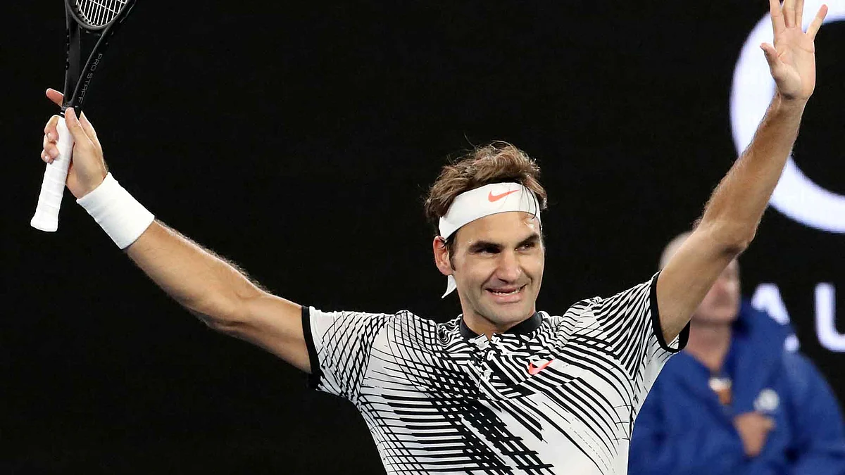 Roger Federer celebrates after winning the Australian Open quarterfinal (Photo: AP)