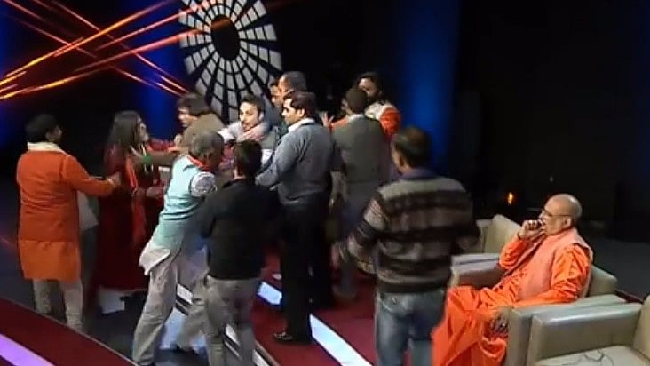 Swami Om gets into a scuffle on national television. (Photo Courtesy: Facebook)