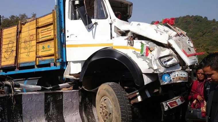 The truck overturned after hitting a concrete railing. (Photo: ANI)