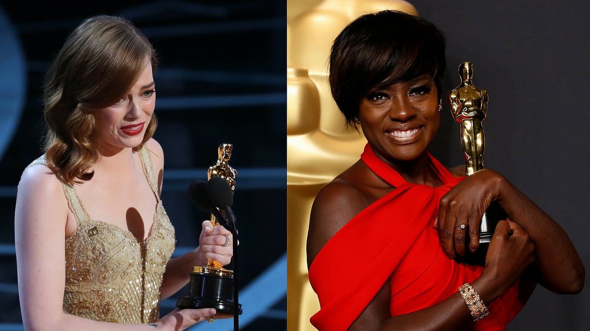 Emma Stone and Viola Davis with their trophies. (Photo: Reuters)