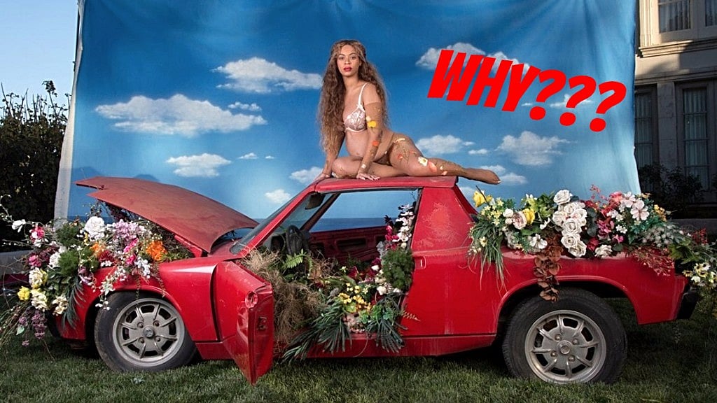 On top of a car, against a shoddy and fake background. (Photo Courtesy: Beyoncé.com)