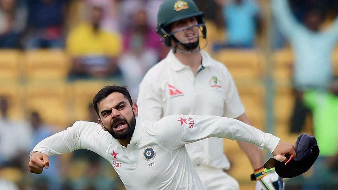 Bengaluru: India’s Virat Kohli celebrate the wicket of Australia’s Mitchell Marsh during the Second day of the second Test match between India and Australia. (Photo: PTI)