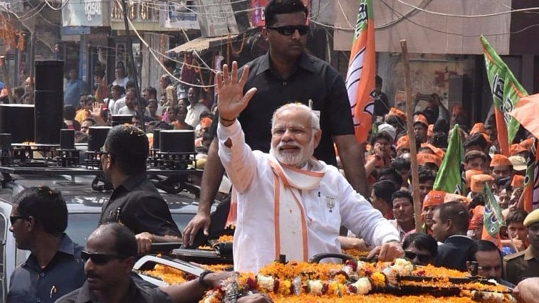 Prime Minister Narendra Modi during a roadshow in Varanasi on 4 March 2017. (Photo: IANS)