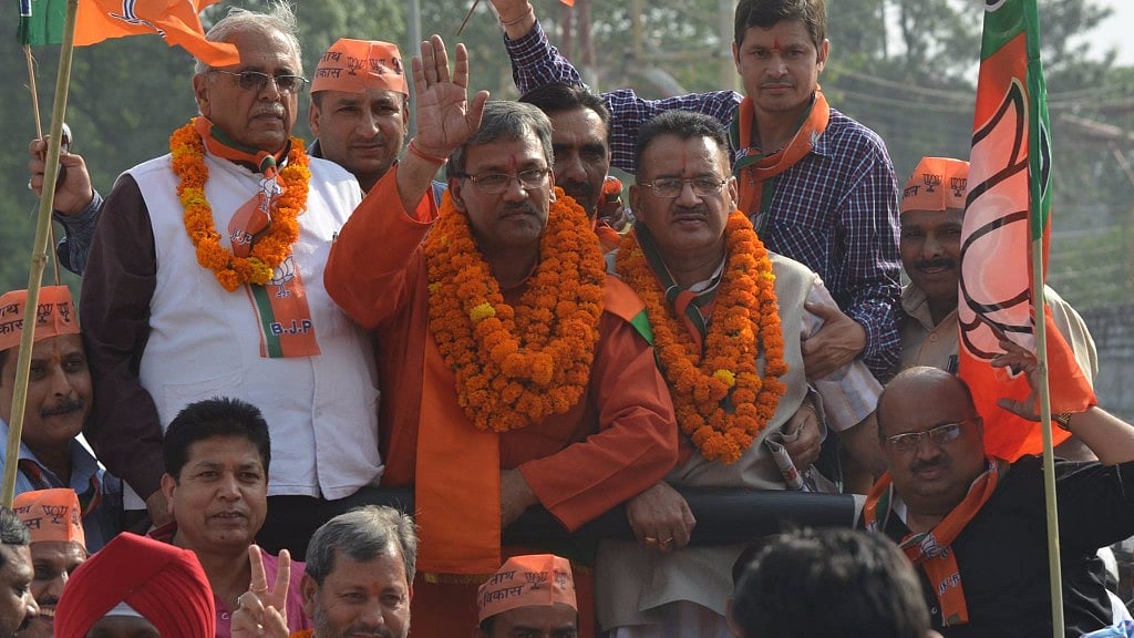 BJP’s Trivendra Singh Rawat will be sworn in as Uttarakhand Chief Minister. (Photo Courtesy: Facebook/<a href="https://www.facebook.com/tsrawatbjp/photos/p.940971209256734/940971209256734/?type=1&amp;opaqueCursor=Abrd1Jnv5EqiU4djCCY-UGQXYZSFVYCfAUAwFR7go44lqAFJ2zTSX8het7FR-MD41lhUotz96tjuKJqkShocTsYsMGmox07qqYvIJVle9yAkk3gcoEa2LmjTqVo1QfB2iOPEKzaMSE4lSsNgZEF1ekkkXW5YTM9dBsY-0UPdYvo9EEElAq6bdYcuRNeqxu3mgdHcL5FtNgvyqfPC7KgIESGuICsWJAVSAz5erwPxsXqjM1LEk8oIrI0A2KygnCZgRM_R0LB3g2mmBt0R4EpMwlrhpFevDvOSuDzBuyjBLgCJ9U8OwPXyyikZk9CmjpKX50QxOk76gKPhHoFHDEC1dkMoVLo9bfglGqeHq8EJ_Wy8cTAqBN2DhG8LJrjJGg-qp4xGGb8ElbvagoAGRLtye5f57UkL_Pua8mqAF6Ikv2xCzKpZH9pskfNXt_59993aPU8&amp;theater">Trivendra Singh Rawat</a>)