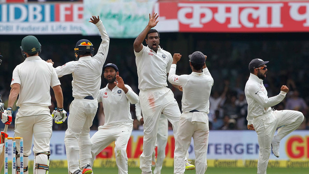 Ashwin celebrates a wicket with his teammates. (Photo: BCCI)