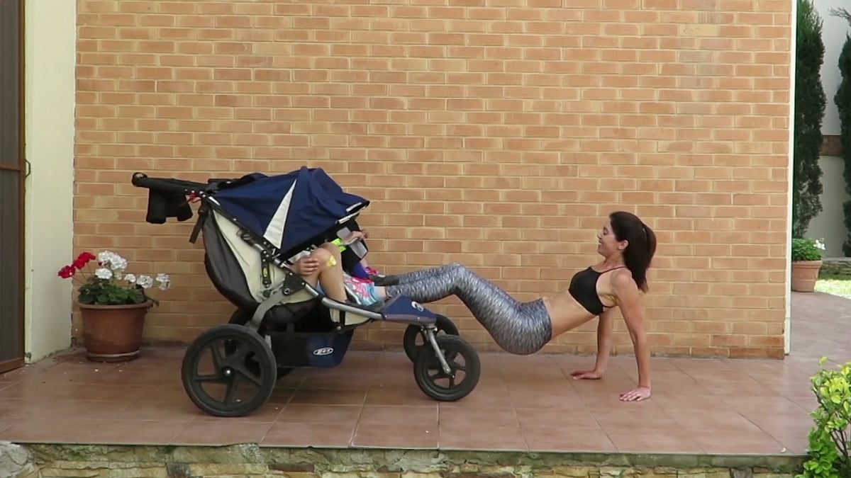 Mother working out with her children (Photo: AP screengrab)