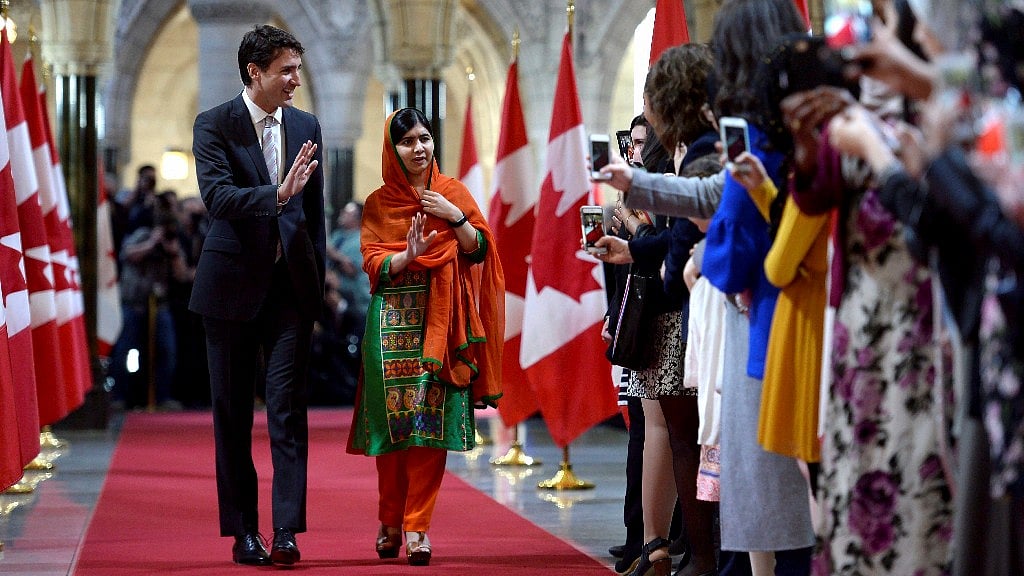 Nobel Peace Prize winner Malala Yousafzai with Canadian Prime Minister Justin Trudeau in Ottawa on Wednesday. (Photo Courtesy: PTI) 