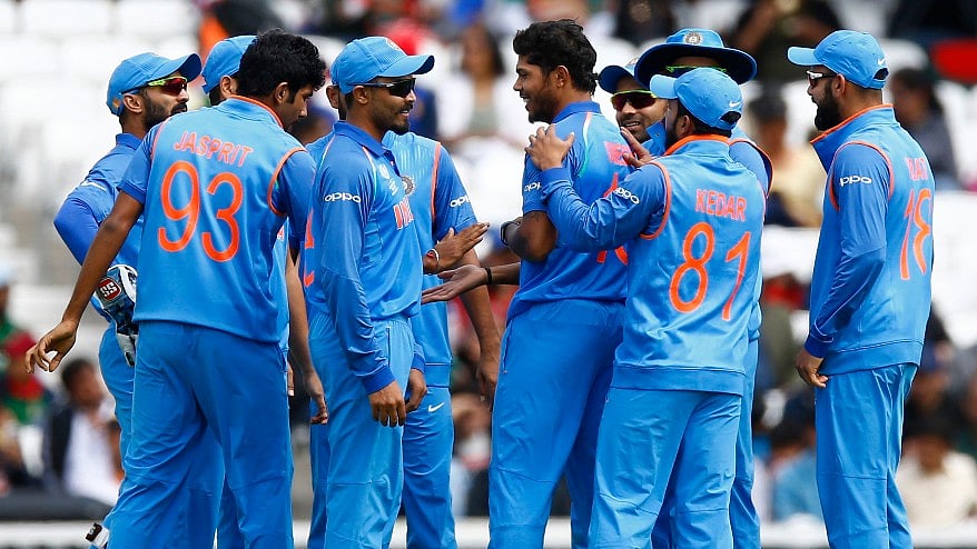 Umesh Yadav celebrates a wicket with his teammates. (Photo: Reuters)