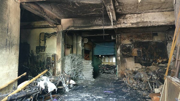 The burnt parking space of the RJES apartment building. (Photo Courtesy: The News Minute)