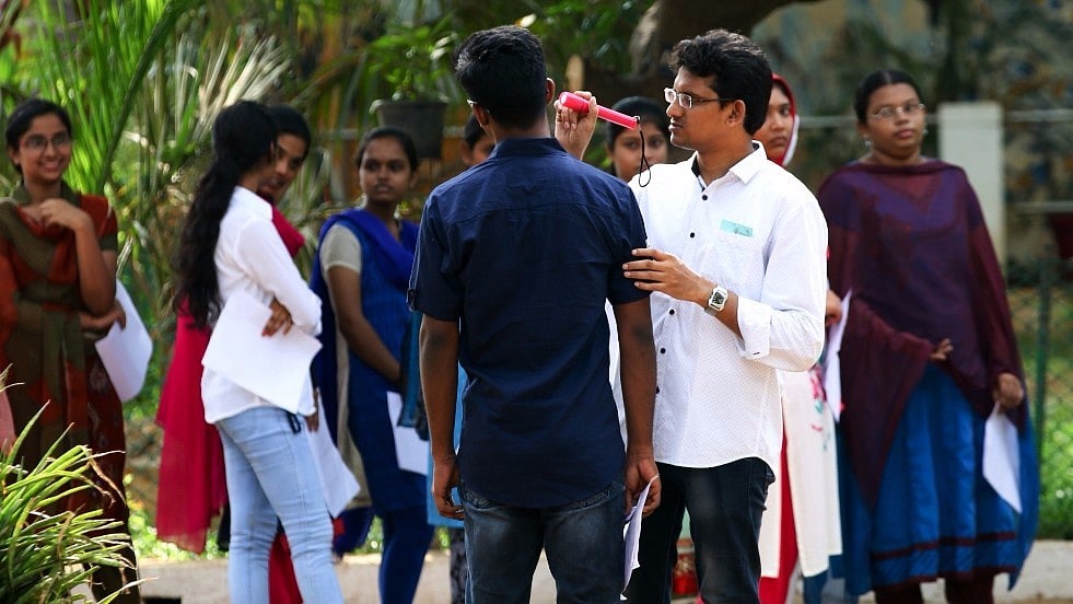 

 Students being frisked before entering the examination hall. Photo used for representational purpose. (Photo: IANS)