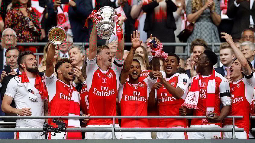 Arsenal players celebrate after beating Chelsea in the FA Cup final on Saturday. (Photo: Reuters)