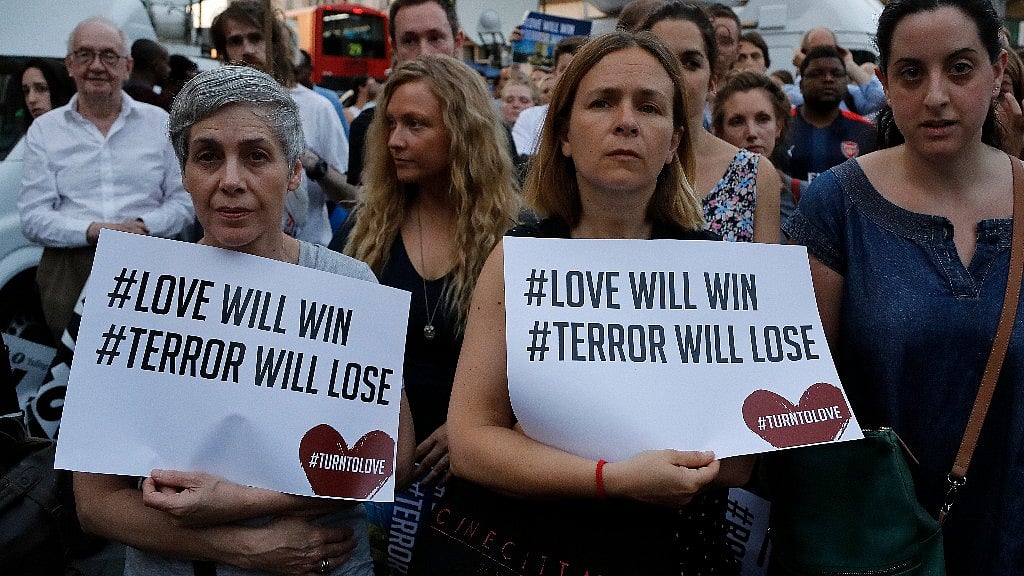 People take part in a vigil at Finsbury Park in north London, where a vehicle struck pedestrians in north London Monday. (Photo: AP)