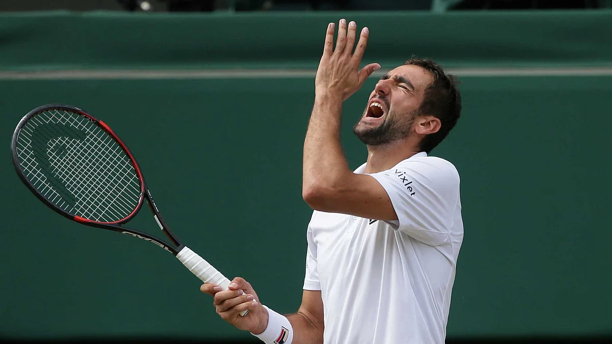 Marin Cilic reacts after losing a point to Roger Federer in the Wimbledon final