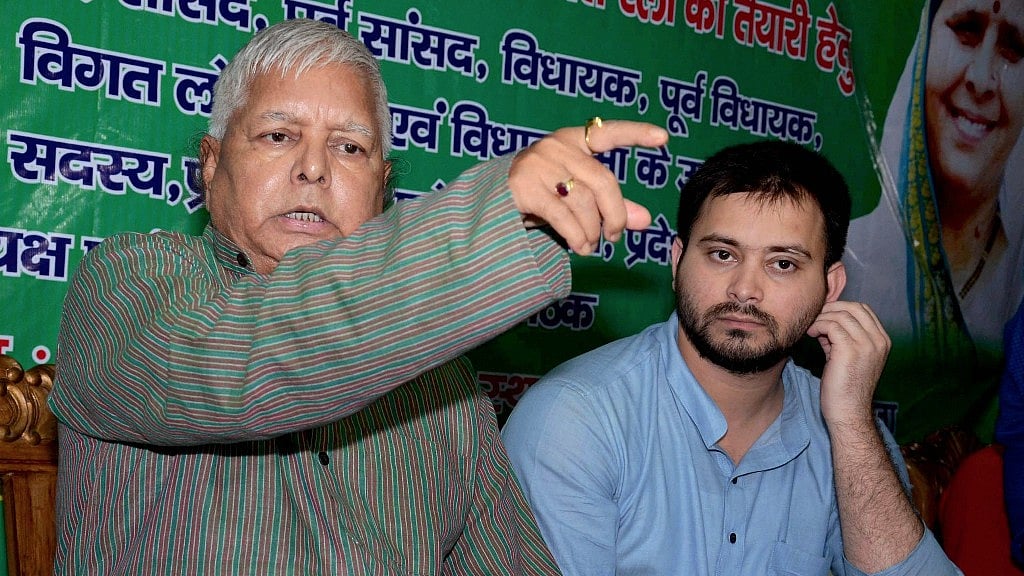 RJD supremo Lalu Yadav with his son and Bihar’s former Deputy Chief Minister Tejashwi Yadav. 