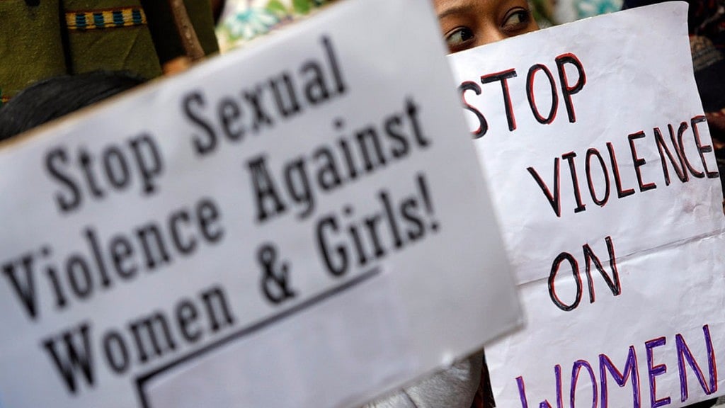 A demonstrator holds placards during a protest in New Delhi on December 29, 2012. Image used for representation.&nbsp;