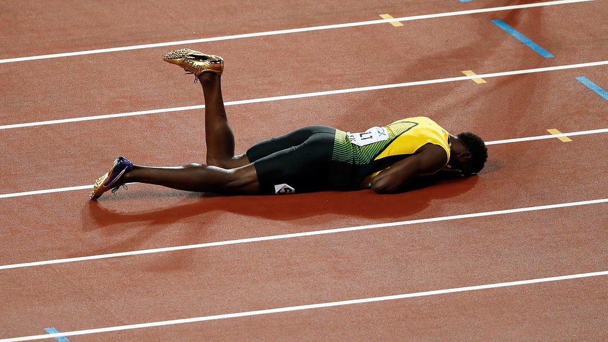 Jamaica’s Usain Bolt lays on the track after he pulled up injured in the final of the Men’s 4x100m relay during the World Athletics Championships