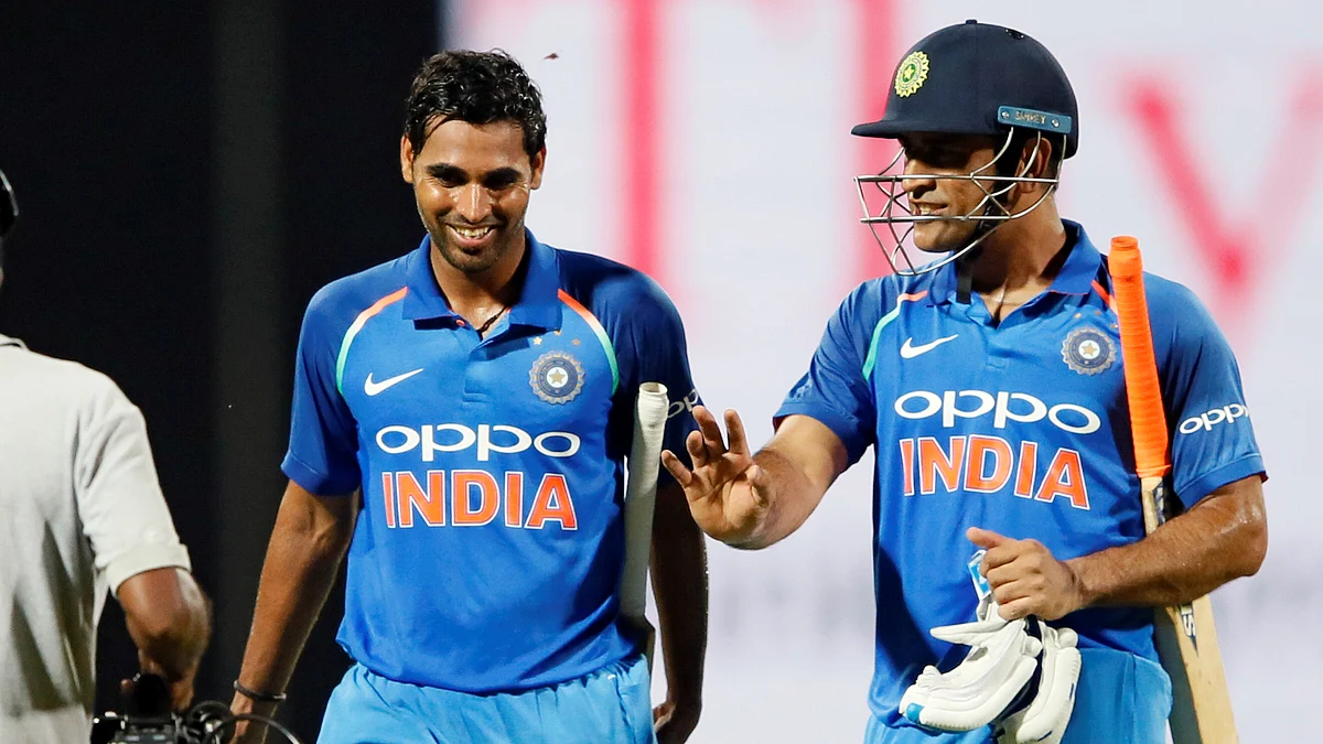 MS Dhoni and Bhuvneshwar Kumar walk back to the pavilion after winning the match for India