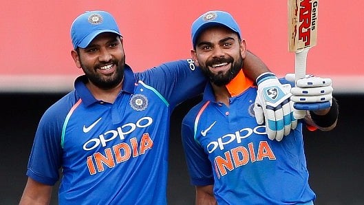 Rohit Sharma and Virat Kohli share a moment during the fourth ODI against Sri Lanka.