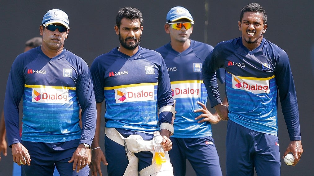 Chamara Kapugedera, Sri Lanka’s stand-in captain, second left, along with bowling coach Chaminda Vaas, left, Dushmantha Chameera and Vishwa Fernando, right, attend a practice session.