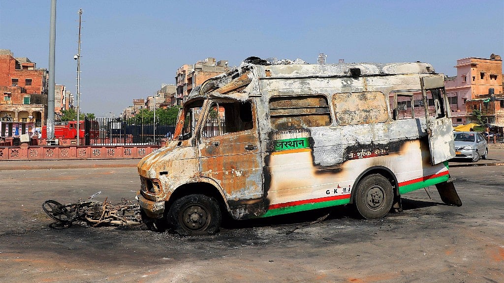 

A torched vehicle after clashes broke out between locals and police in Jaipur.&nbsp;