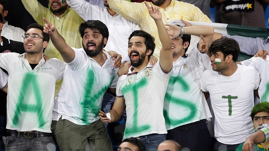 Pakistani fans watch the first T20 between World XI and Pakistan at the Gaddafi stadium in Lahore on Tuesday.