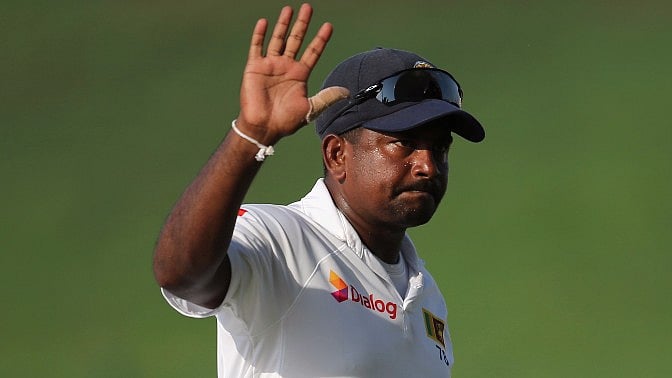 Rangana Herath waves to the crowd after the first Test between Sri Lanka and Pakistan.