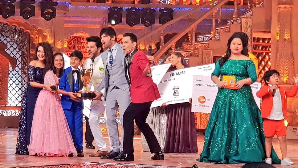 Shreyan Bhattacharya and Anjali Gaikwad share the <i>Sa Re Ga Ma Pa Lil Champs </i>trophy.