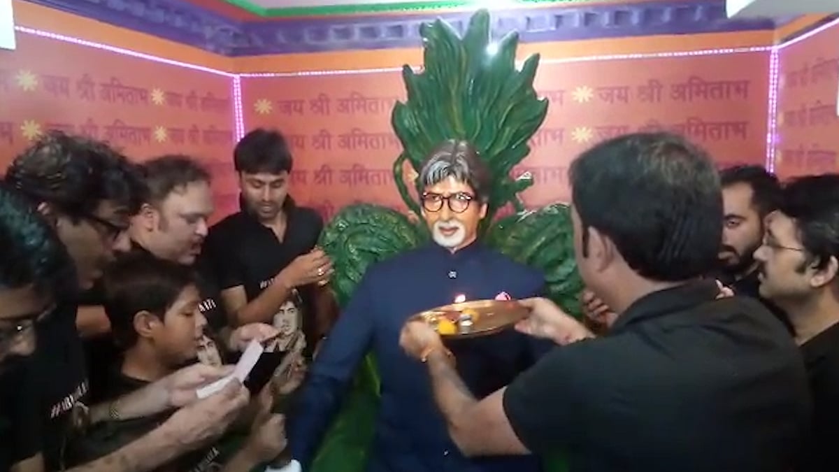 Fans perform puja at the temple dedicated to Amitabh Bachhan.