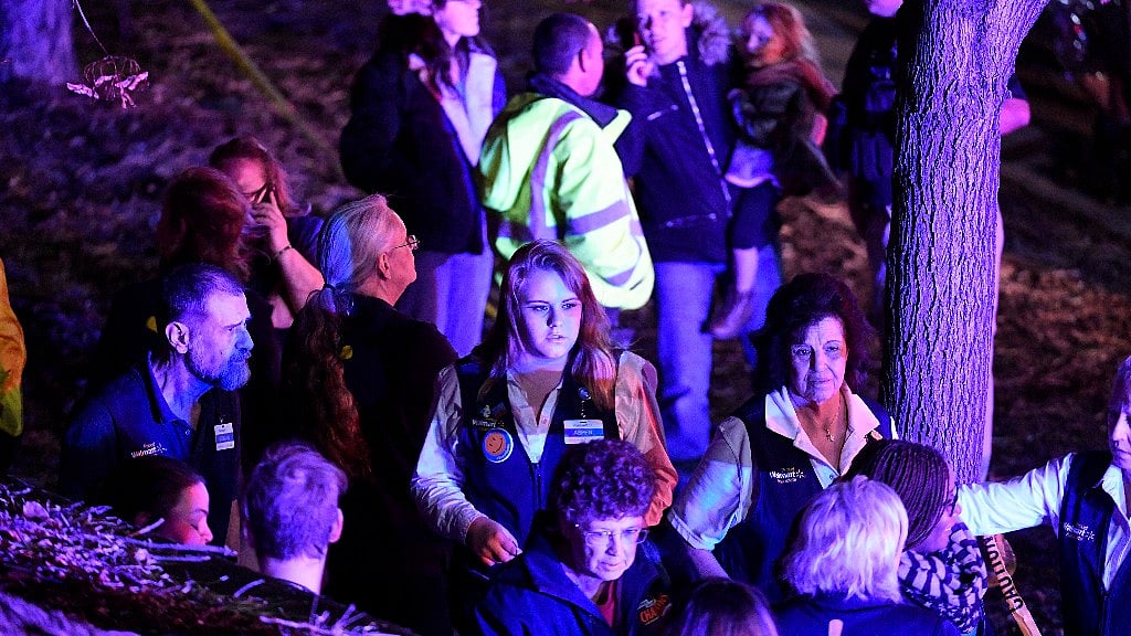 Walmart employees standing away from the scene of crime at the Walmart store in Thornton, Denver in Colorado state.