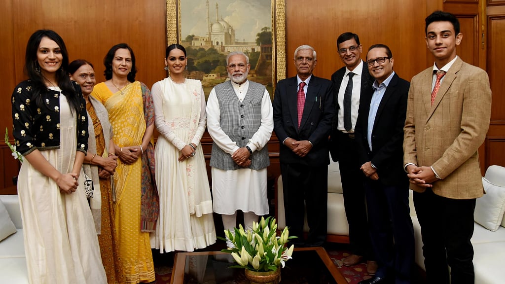 Prime Minister Narendra Modi with Miss World Manushi Chhillar and family.