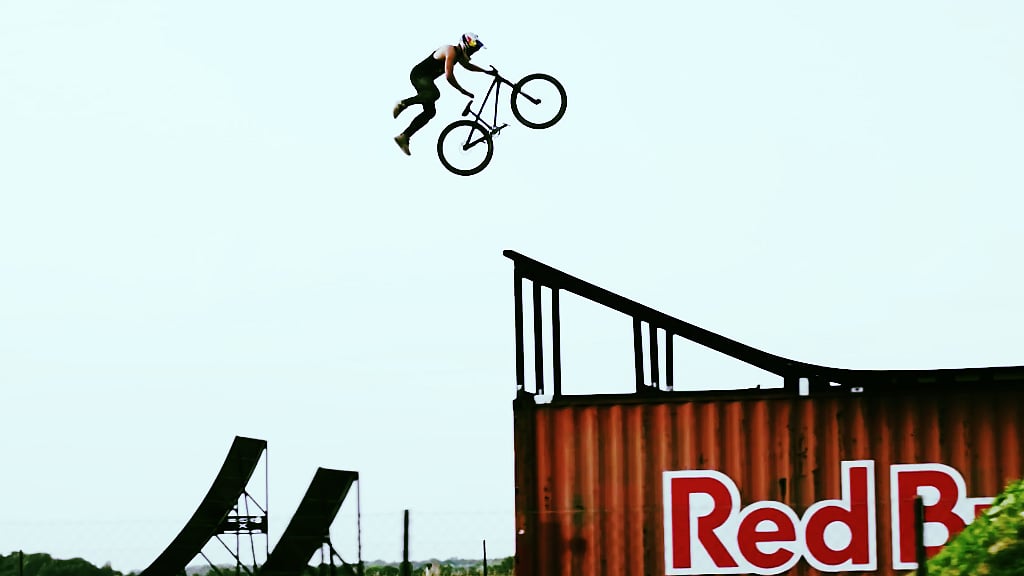 MTB rider Szymon Godziek from Poland performed world’s first ever backflip superman one hand seat grab. 