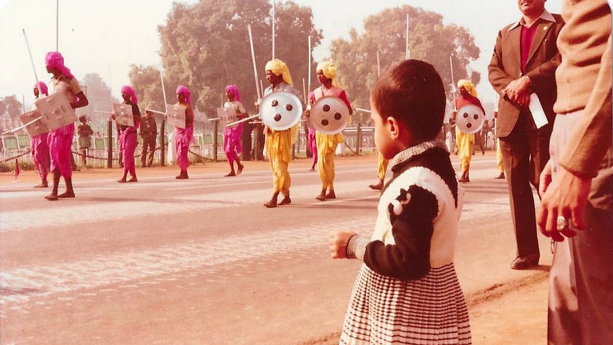 A young member of the family taking a closer look at one of the performances during the parade