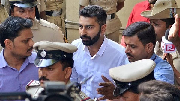 Youth Congress general secretary Mohammed Haris Nalapad being taken away by the police for allegedly assaulting a person in Bengaluru on Monday, 26 February.&nbsp;