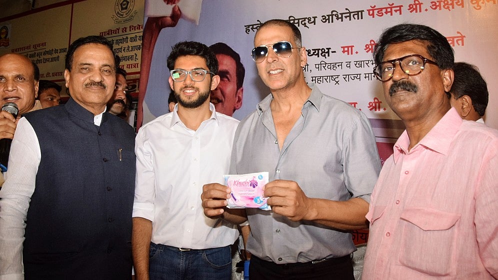 Akshay Kumar and Aaditya Thackeray pose with a sanitary napkin. The duo  inaugurated a sanitary pad vending machine in Mumbai Central ST Bus Depot.&nbsp;