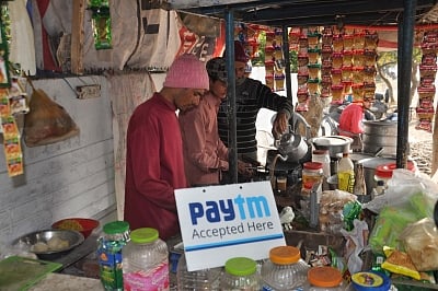 Dehradun: A tea stall owner display a sign accepting mobile payment in Dehradun on Nov. 19, 2016. (Photo: IANS)