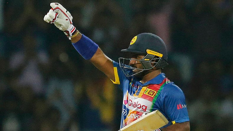 Kusal Perera celebrates after scoring a half-century.