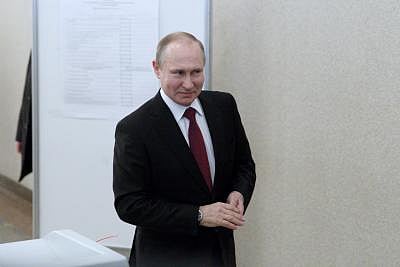 MOSCOW, March 18, 2018 (Xinhua) -- Russian President Vladimir Putin leaves a polling station after voting in Moscow March 18, 2018. Russia held presidential election on Sunday. (Xinhua/Bai Xueqi/IANS)