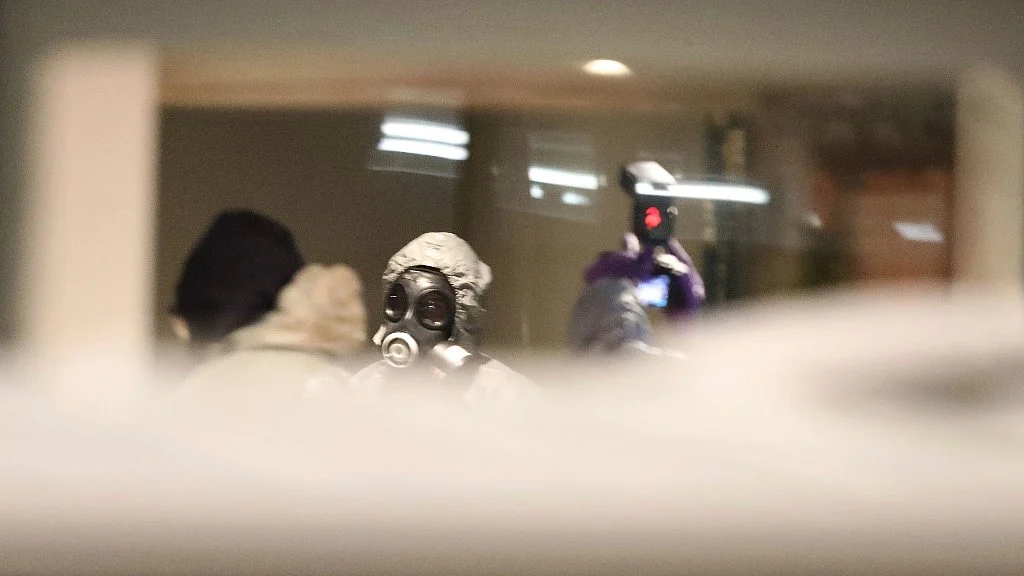 Investigators inside the Zizzi restaurant in Salisbury, England, Tuesday, March 6, 2018 near to where former Russian double agent Sergei Skripal was found critically ill.