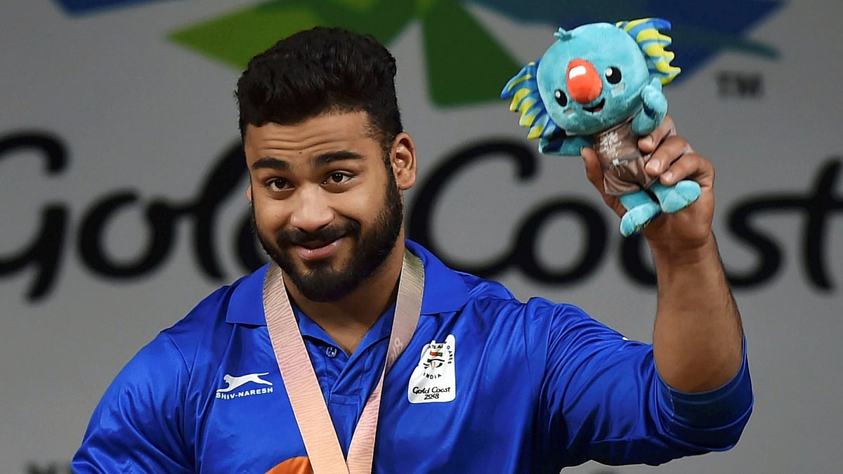 India’s Vikas Thakur shows bronze medal during medal ceremony of the men’s 94kg Weightlifting category during the Commonwealth Games 2018 in Gold Coast, Australia on Sunday.