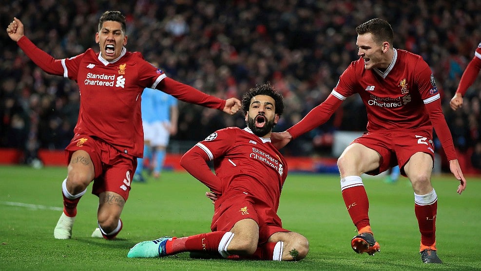 Liverpool’s Mohamed Salah (centre) celebrate with teammates after scoring his side’s first goal of the game during the Champions League quarter final against Manchester City at Anfield.