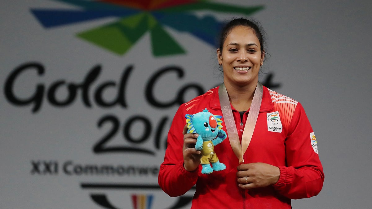 India’s Women’s 69Kg Weightlifting Gold medalist Punam Yadav poses for the photographer during medal ceremony at the Commonwealth Games in Gold Coast, Australia, Sunday, April 8, 2018. 