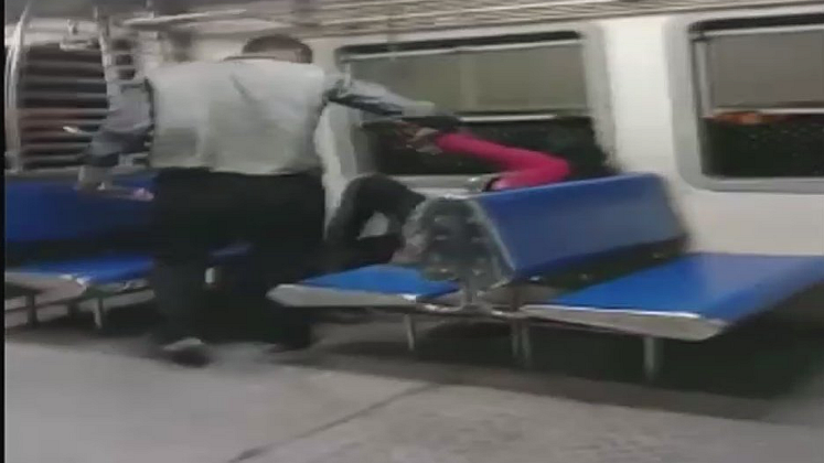 A visual from the amateur video that captured the horrific incident of a passenger being molested on a Mumbai local.