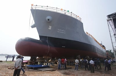 Titagarh: A 1000T fuel barge - built by a private company for the Indian Navy - being released in water in Titagarh near Kolkata on May 17, 2018. (Photo: IANS)