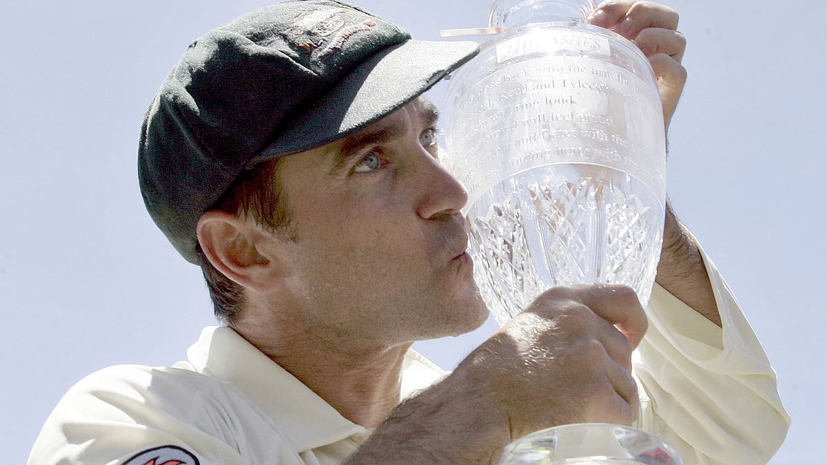 In this Jan. 5, 2007 file photo Australia’s Justin Langer kisses the Ashes trophy as he  celebrates winning the cricket series against England in Sydney, Australia. Former test opener Langer was confirmed as the new head coach of the Australian cricket team on Thursday, May 3, 2018.