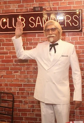 New Delhi: Actor Denzil Smith disguised as KFC founder Colonel Sanders during a promotional programme in New Delhi, on June 28, 2018. (Photo: IANS) Caption: New Delhi: Actor Denzil Smith disguised as KFC founder Colonel Sanders addresses during a promotional programme in New Delhi, on June 28, 2018. (Photo: IANS)