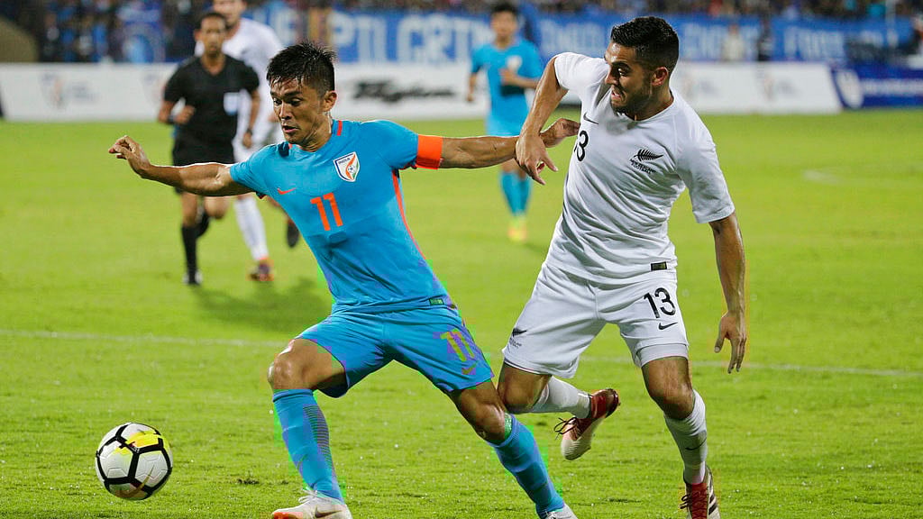 India’s football captain Sunil Chhetri, center, fights for the ball with Justin Gulley of New Zealand during the Intercontinental Cup match.&nbsp;