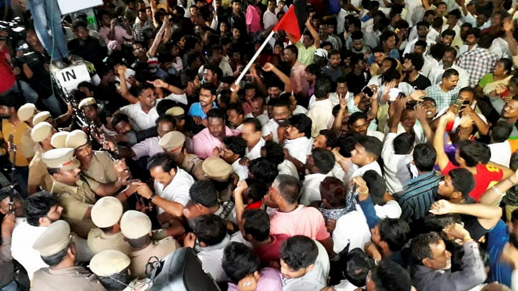 DMK supporters wait outside the Kauvery Hospital, where party chief M Karunanidhi is admitted. 