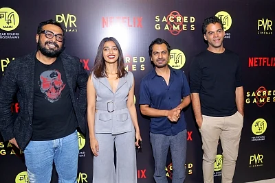 Director Anurag Kashyap with actors Radhika Apte and Nawazuddin Siddiqui at the special screening of film "Sacred Games". (Photo: IANS)