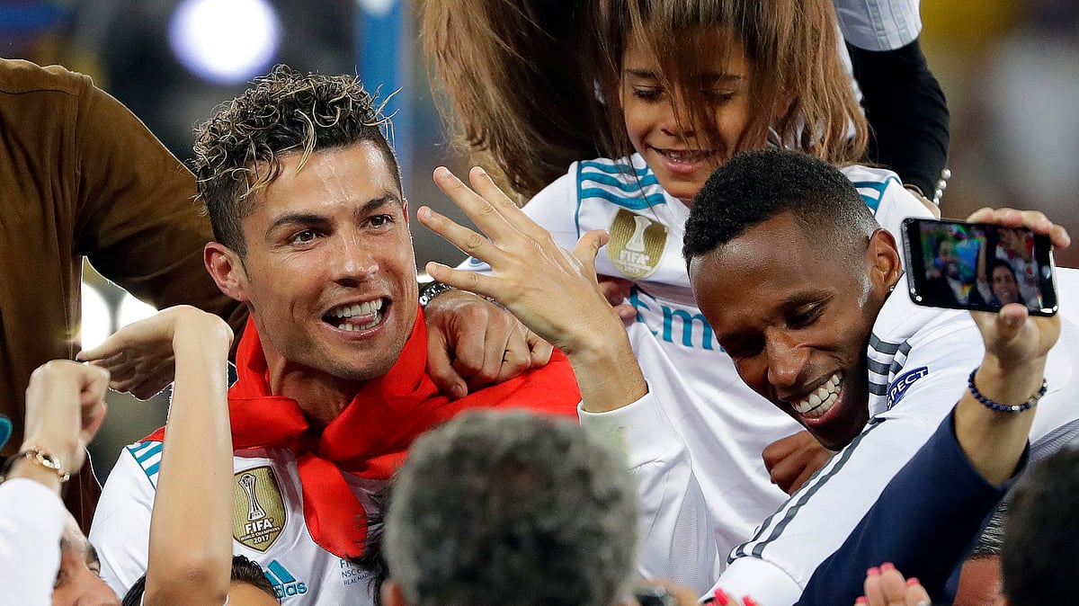 In this Saturday, May 26, 2018 file photo Cristiano Ronaldo celebrates with family after winning the Champions League Final match between Real Madrid and Liverpool at the Olimpiyskiy Stadium in Kiev, Ukraine. 